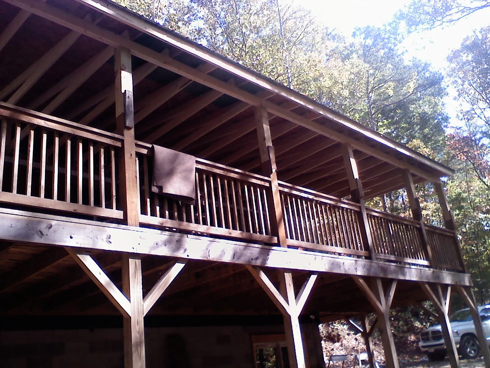 Timber framing under a new elevated porch and deck in Lewis